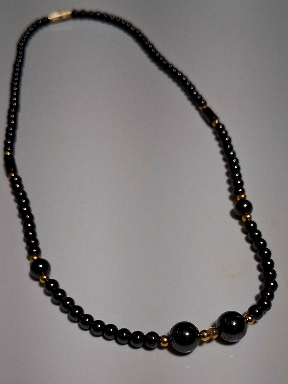 Elegant Black Beaded Necklace with Gold Accents